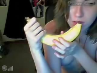 Blue eyed teen licking and sticking bannana 2