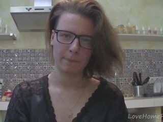 Solo mistress with glasses chatting in the kitchen